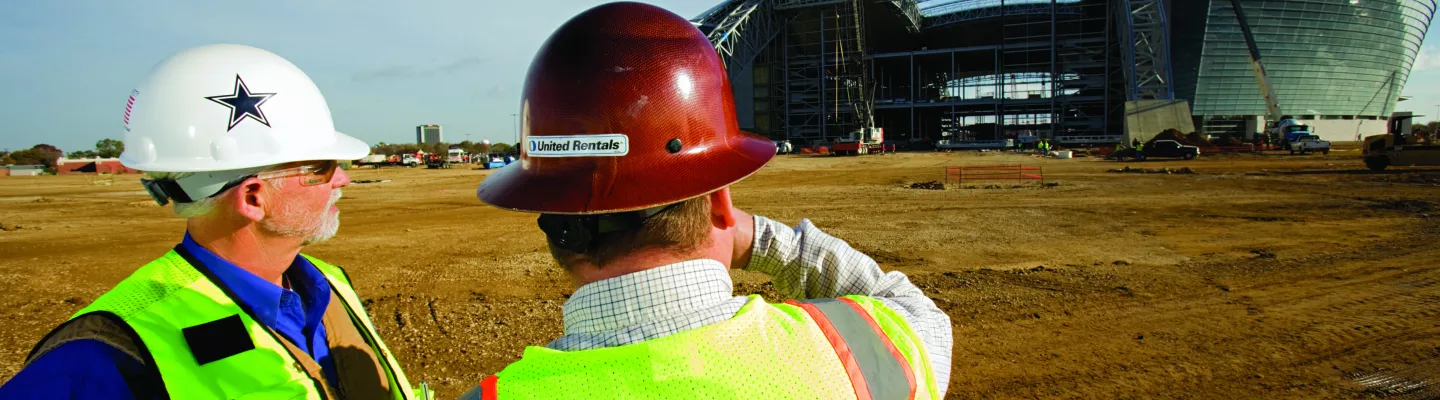 two men in hard hats on construction site