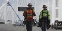 two men in hard hats on construction site
