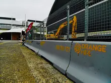 Safety barriers installed around a construction site to protect workers and restrict unauthorized access.