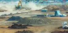 Various types of barriers and fencing installed on a worksite to ensure safety and control access around construction areas.